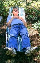 Man asleep in the woods.