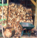 wheelbarrow by woodshed