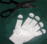 Cutting the fingers out of gloves.