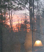 Sunrise through the window with interior reflecctions.