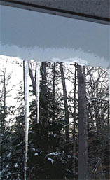 Ice sheet overhanging roof.