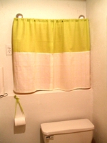 Bathroom Curtains Homemade over boarded up window.