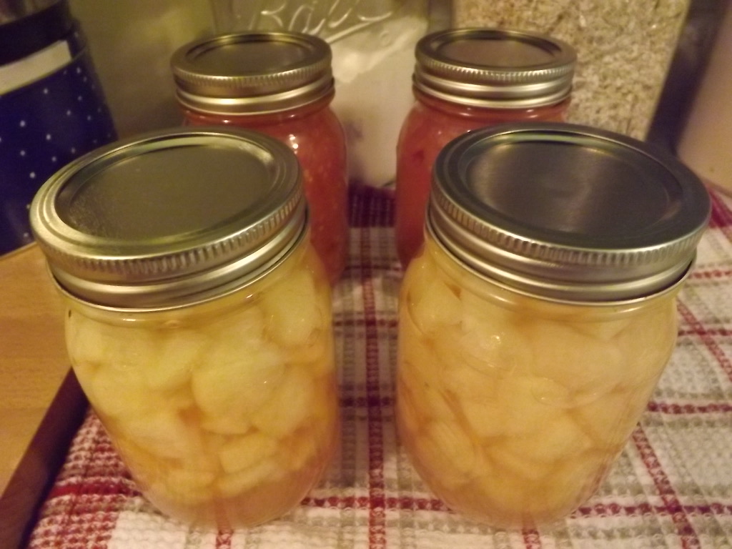 jars of tomatoes and apples