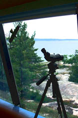 telescope in foreground of view of Georgian Bay