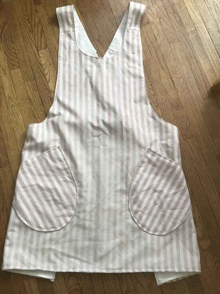 The apron prototype, made from worn out bed sheets, cost free at this point.