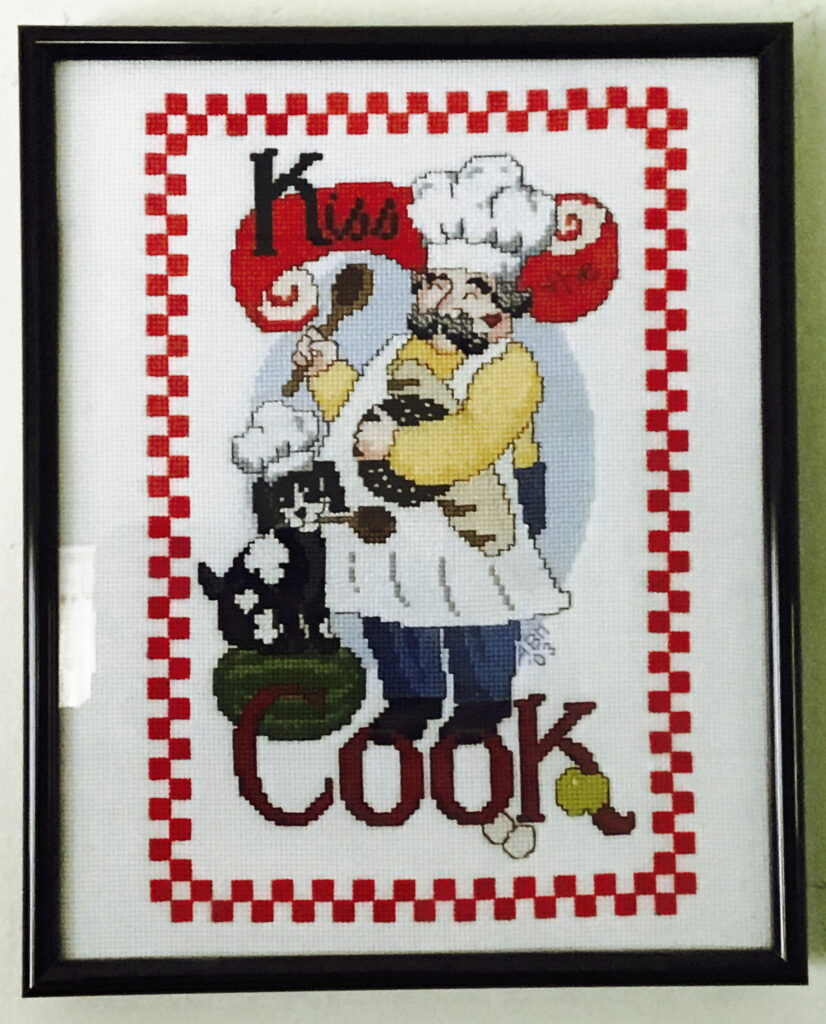 kisss the cook image, chef and dog with chef hats and wooden spoons